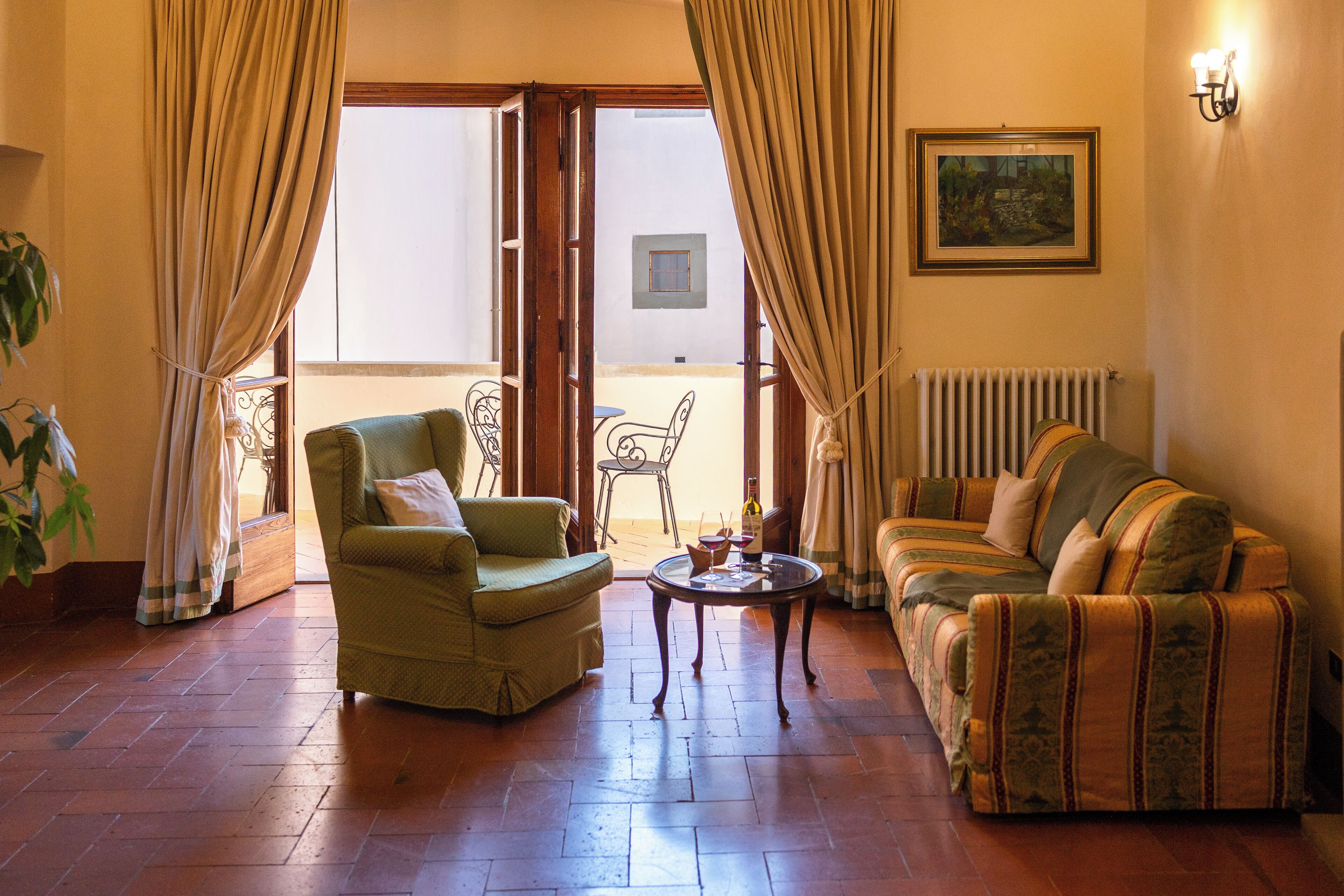 Appartamento Deluxe | Area soggiorno | TV a schermo piatto