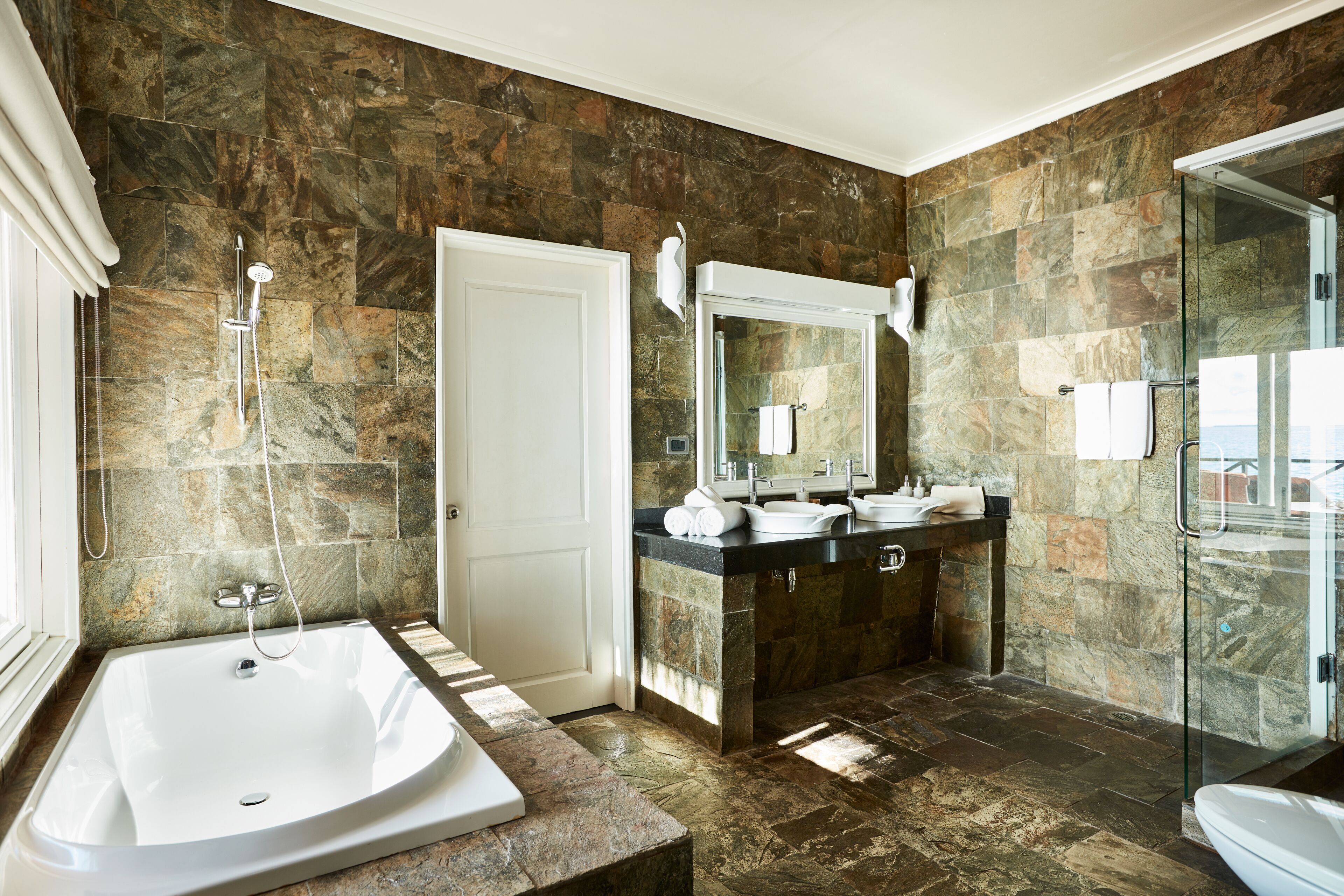 separate bathtub and shower, free toiletries, hair dryer, bathrobes