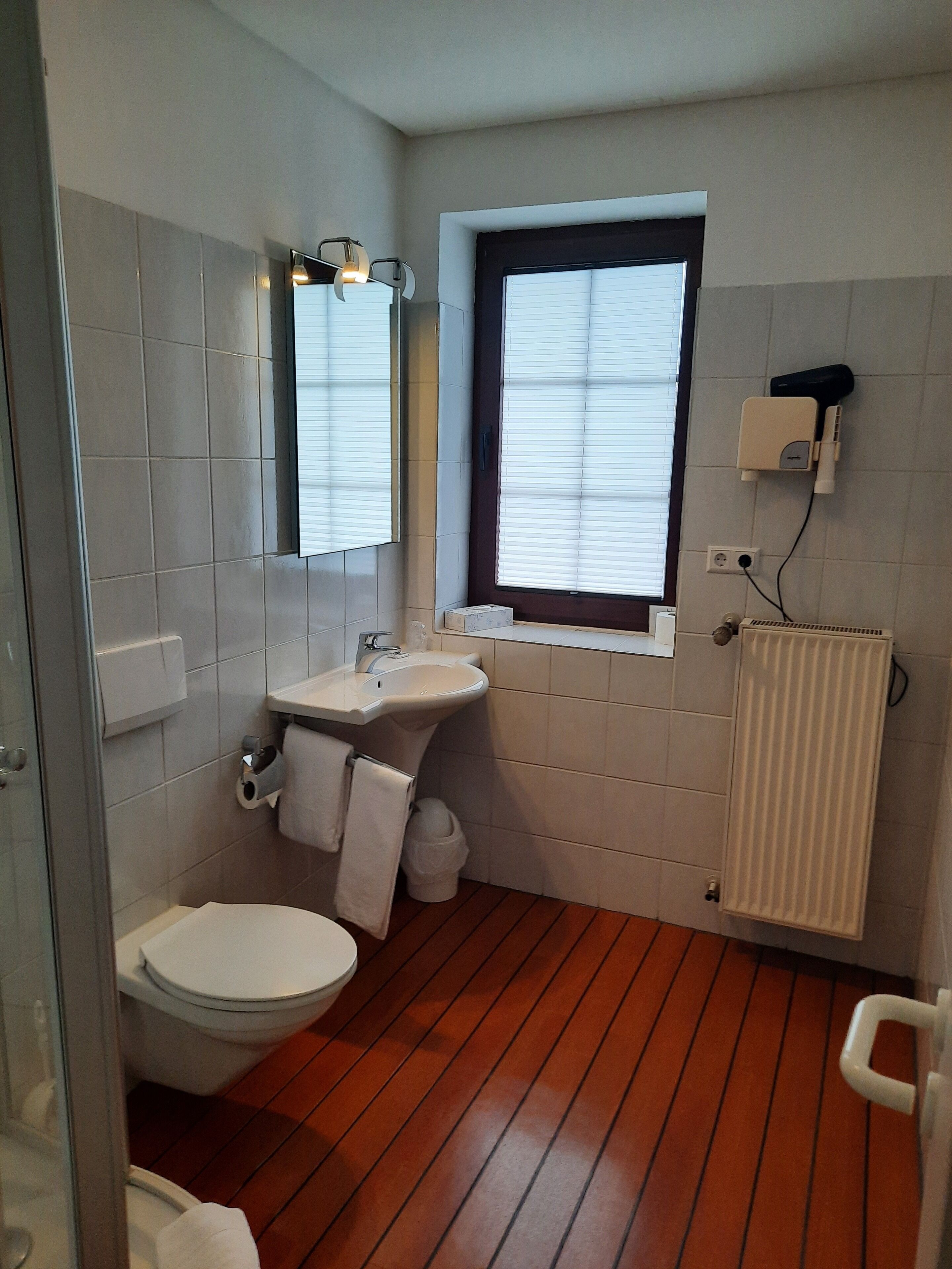 Shower, free toiletries, hair dryer, slippers