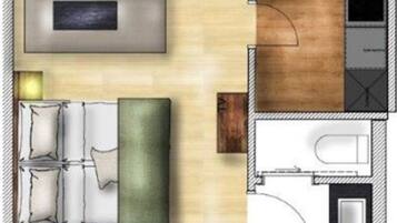 Ein Grundriss eines Hotelzimmers mit Bett, Sitzecke, Badezimmer und einer kleinen Küchenzeile.