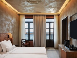 Deluxe Suite, Balcony, Sea View | In-room safe, desk, laptop workspace, blackout drapes
