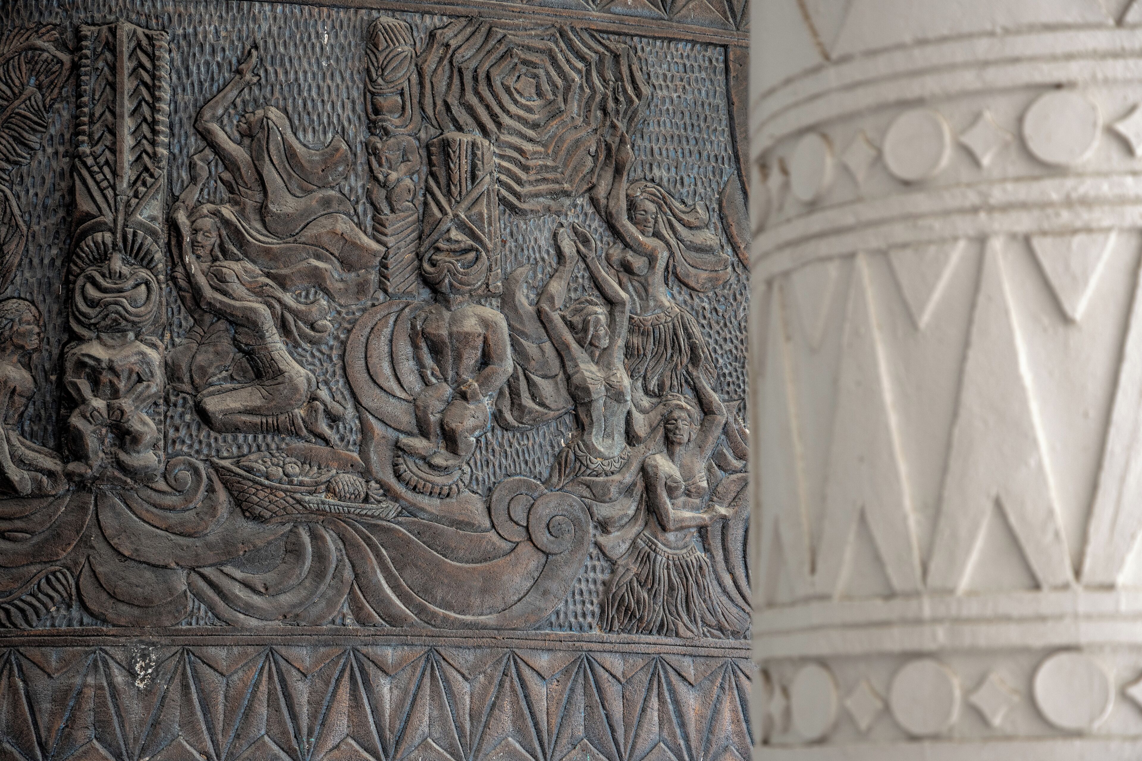 A detailed stone carving with intricate designs and figures.