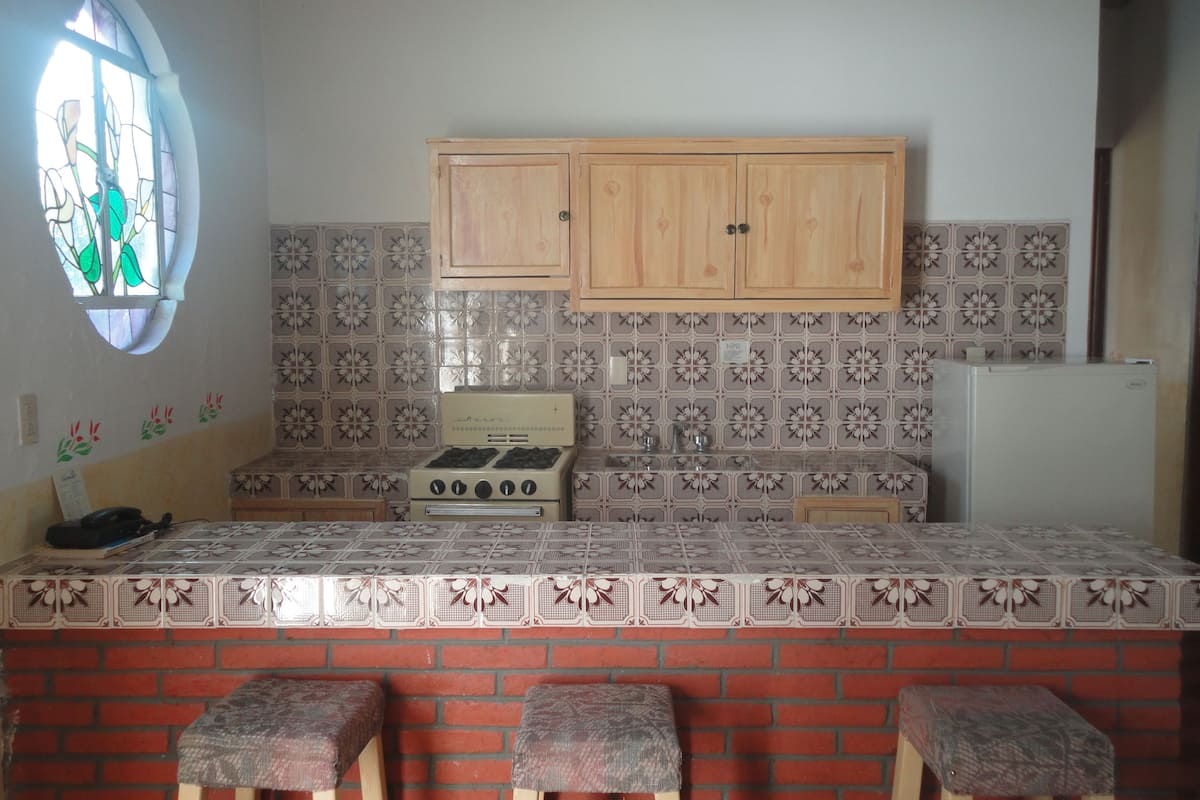 fridge, stovetop, cookware/dishes/utensils