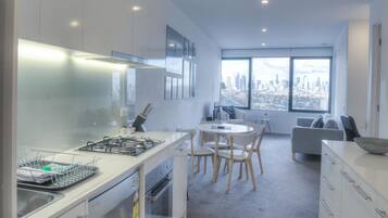 Two Bedroom Apartment - City View | Private kitchen | Coffee/tea maker, full-size fridge, microwave, oven