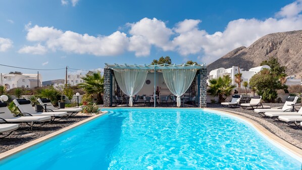 Outdoor pool, open 7:30 AM to 8:30 PM, pool umbrellas, pool loungers