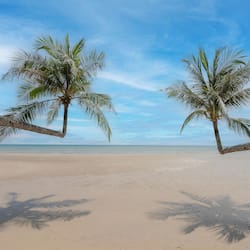 On the beach, white sand, beach towels, beach massages