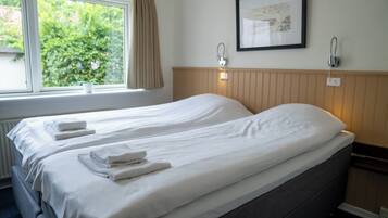 Desk, laptop workspace, free WiFi, bed sheets