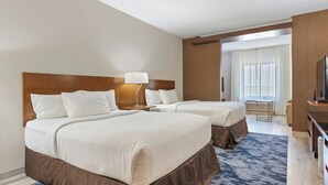 A hotel room with two beds, a desk, a TV, and a large window. - Fairfield Inn & Suites Alamosa (Alamosa)