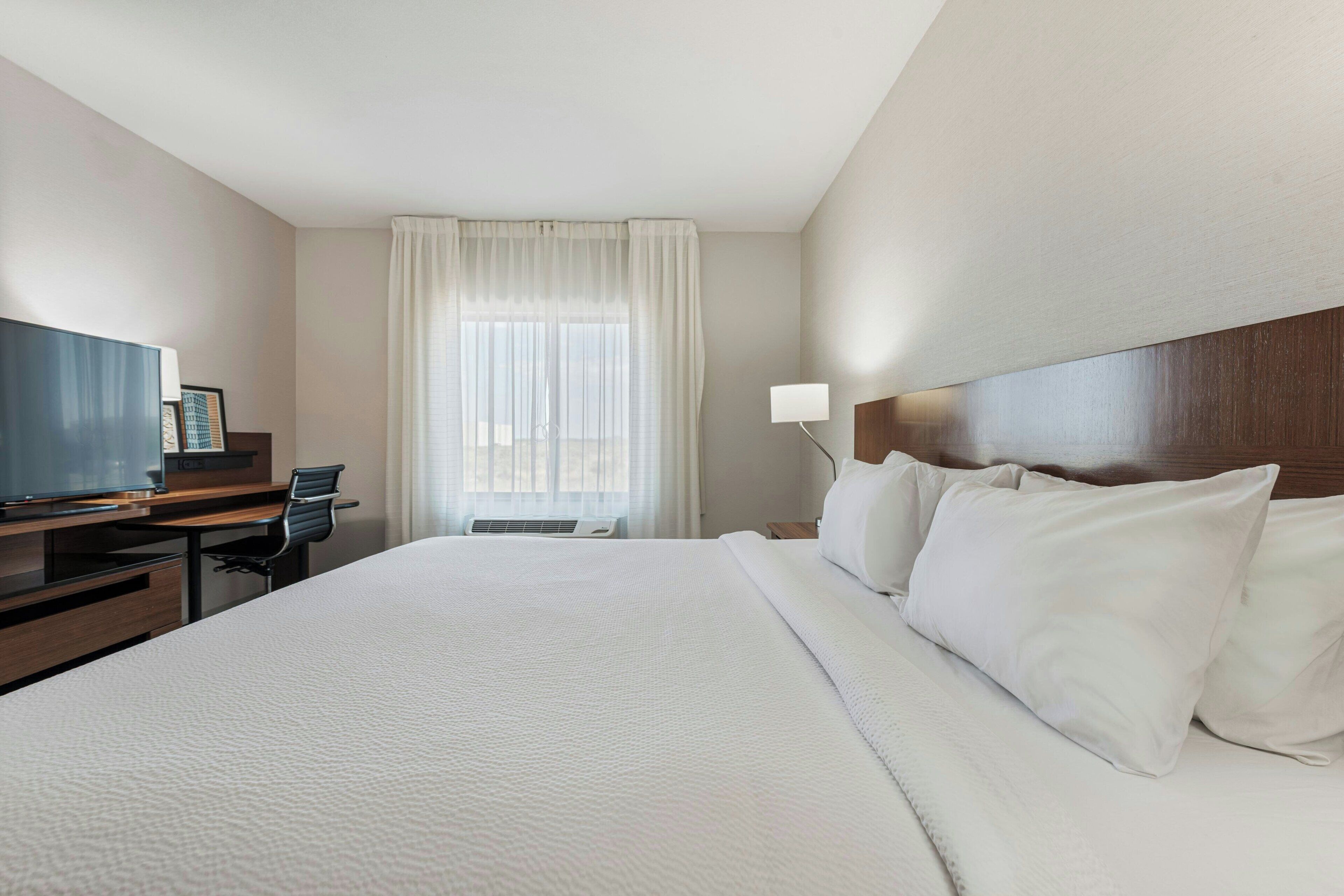 Desk, laptop workspace, iron/ironing board, free cribs/infant beds