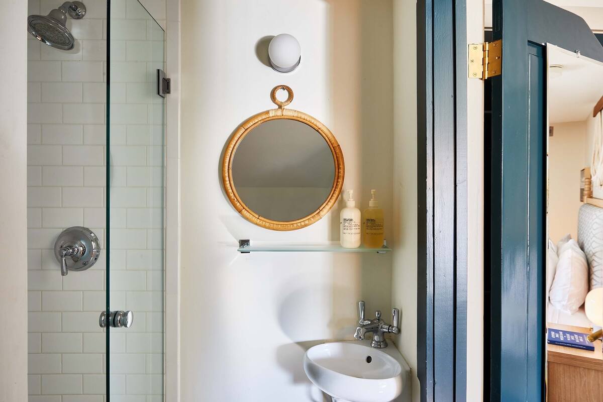 comfort room | bathroom | rainfall showerhead, designer toiletries, hair dryer, towels