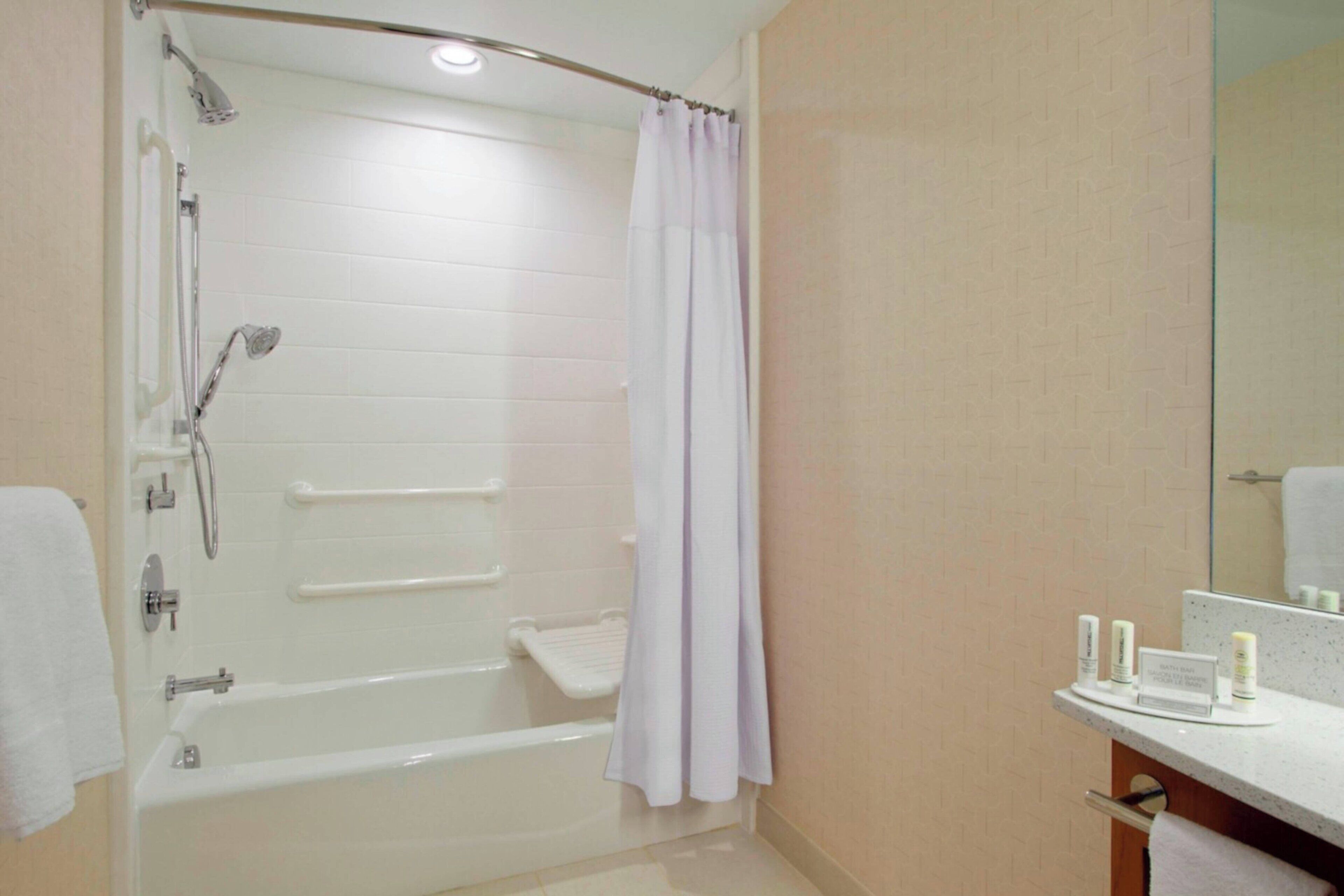 combined shower/bathtub, free toiletries, hair dryer, towels
