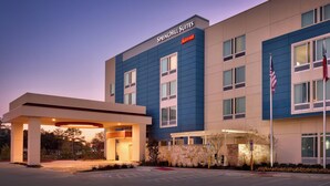 A modern hotel with a blue and beige facade, labeled "Springhill Suites Marriott." - Springhill Suites Houston I-45 North (Houston)