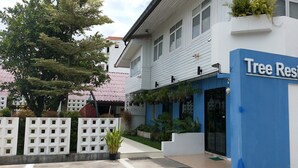 A building with a sign reading "Tree Residences" and a visible entrance. - Tree Residences (Chiang Mai)