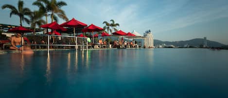 Outdoor pool, open 7 AM to 8:00 PM, free pool cabanas, pool umbrellas