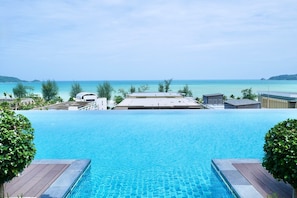 Outdoor pool, open 7 AM to 8:00 PM, free cabanas, pool umbrellas