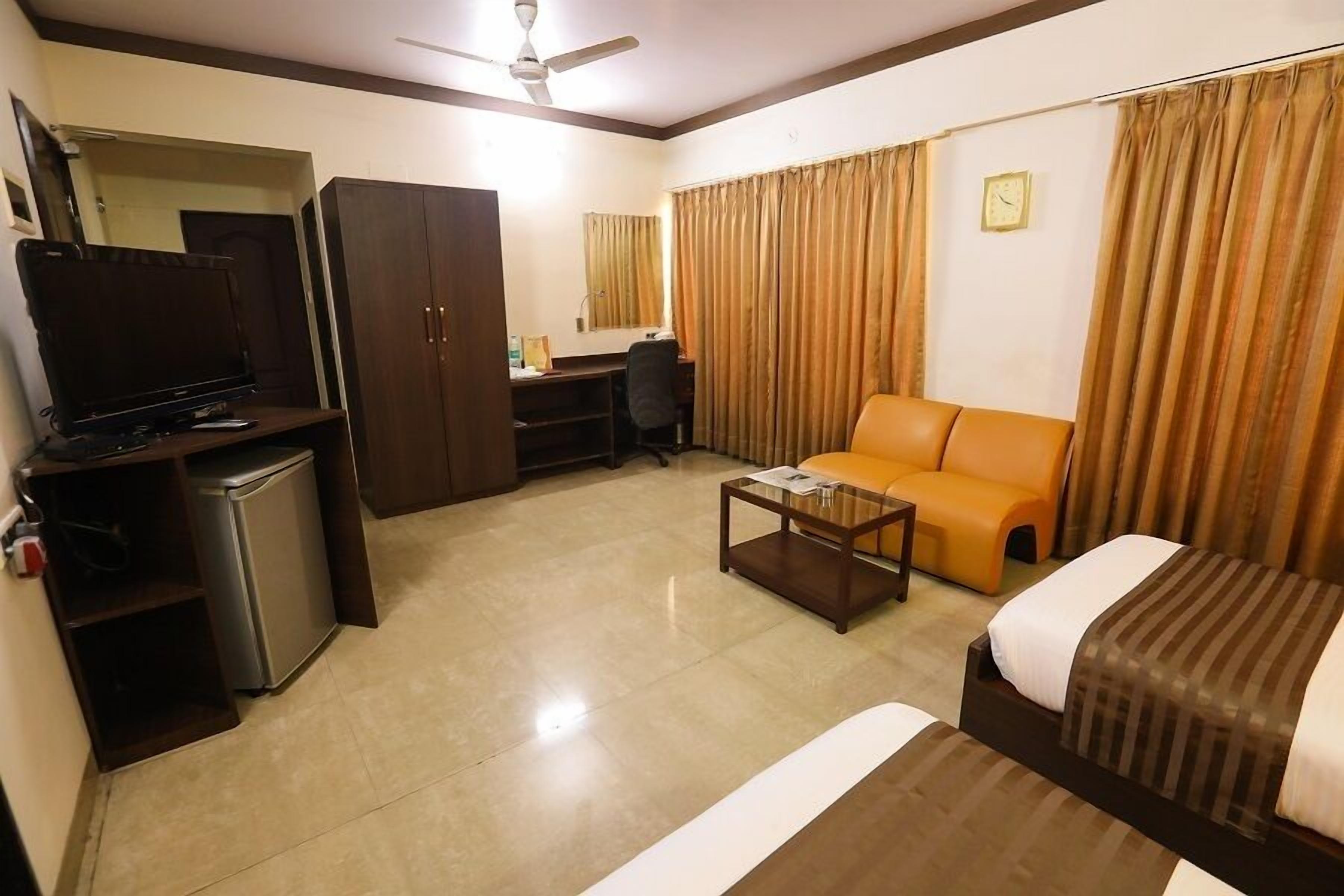 deluxe room | in-room safe, desk, blackout curtains, iron/ironing board