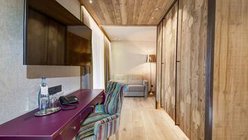 Suite, Balcony, Mountain View (Kuschelsuite) | Living area | Flat-screen TV, table football, ping pong, books