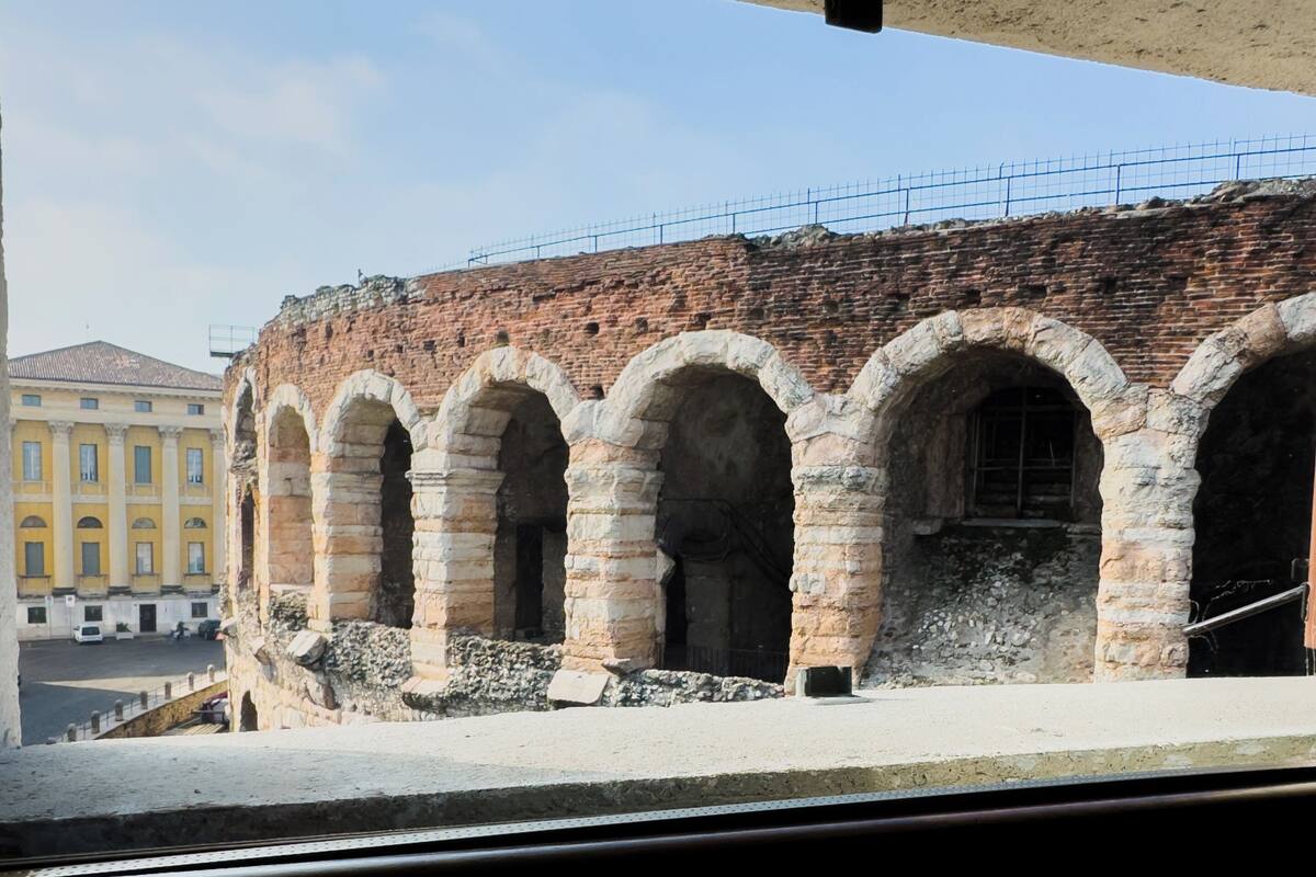 A historical building with multiple arches and a brick facade.