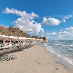 Private beach, black sand, sun loungers, beach umbrellas