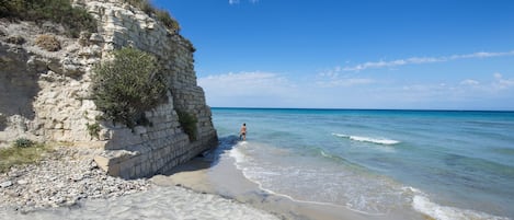 Private beach, black sand, sun-loungers, beach umbrellas