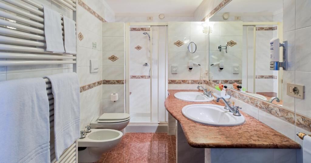junior suite, balcony | bathroom | shower, eco-friendly toiletries, hair dryer, bathrobes