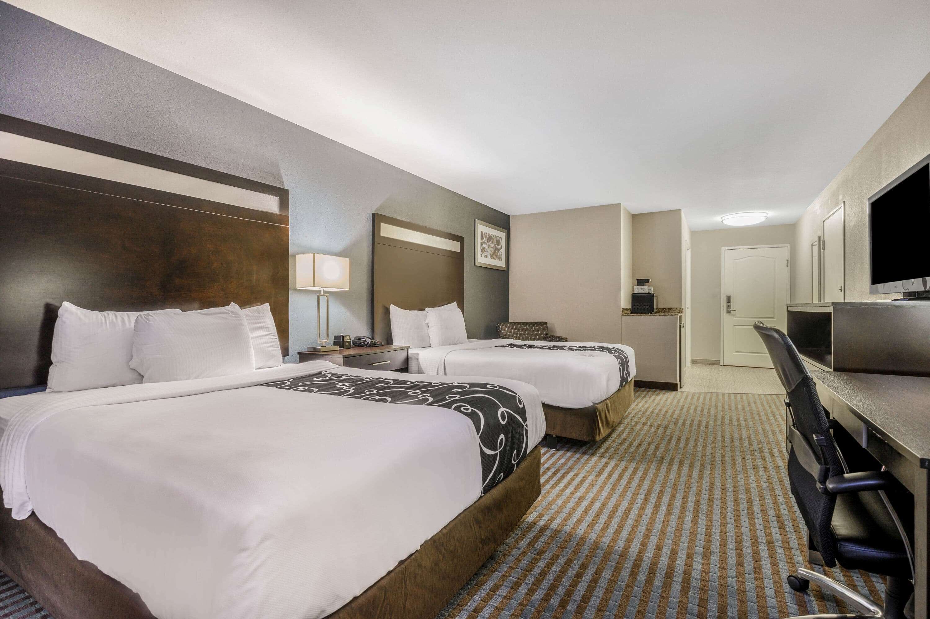 premium bedding, pillow-top beds, desk, blackout curtains