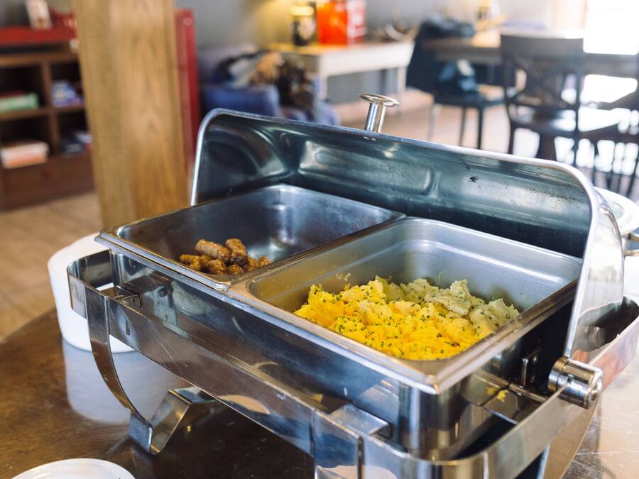 A buffet setup with two open compartments containing food items.