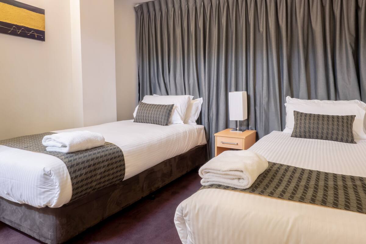 Two Bedroom Standard Apartment - (no view) Riverside Tower | Desk, blackout drapes, iron/ironing board, cribs (surcharge)