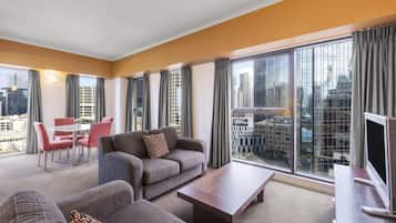 One Bedroom Deluxe Apartment - Riverside Tower | Desk, blackout drapes, iron/ironing board, cribs/infant beds