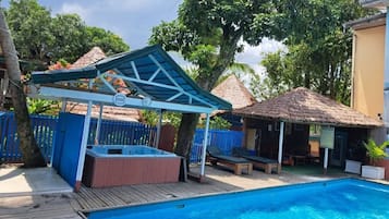 Outdoor pool, open 9:00 AM to 9:00 PM, pool umbrellas, pool loungers
