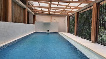 Outdoor pool, open 9:00 AM to 9:00 PM, pool umbrellas, pool loungers