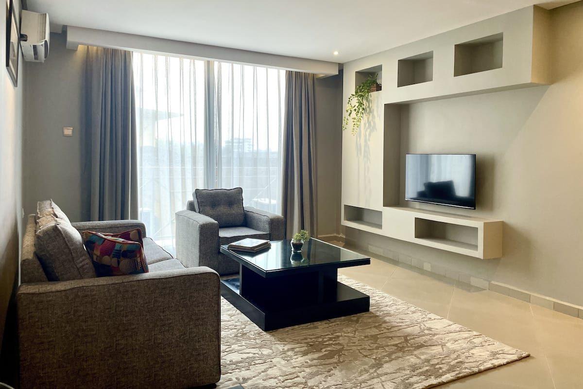 Executive Suite, 1 King Bed, Balcony, Courtyard View | Living area | 42-inch LED TV with cable channels, TV