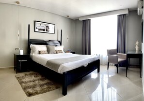 Executive Suite, 1 King Bed, Balcony, Courtyard View | Premium bedding, in-room safe, individually decorated, desk - Mackinnon Suites (Kampala)