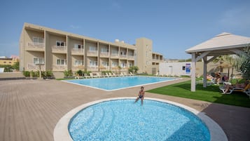 Outdoor pool, pool umbrellas, pool loungers