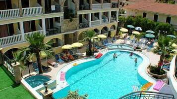 Seasonal outdoor pool, open 8:00 AM to 7:30 PM, pool umbrellas