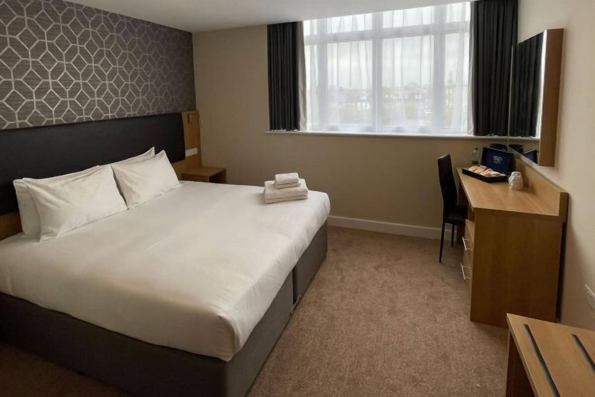 Desk, blackout drapes, iron/ironing board (on request), WiFi (free)