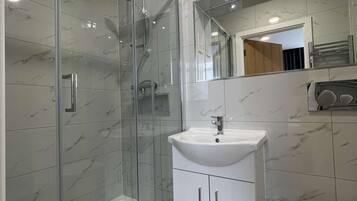 Shower, free toiletries, hair dryer, towels