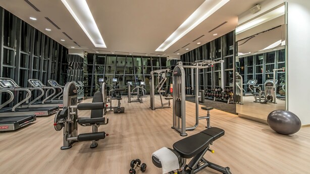 A modern gym with treadmills, weight machines, and free weights. - Ascott Sentral Kuala Lumpur (Kuala Lumpur)