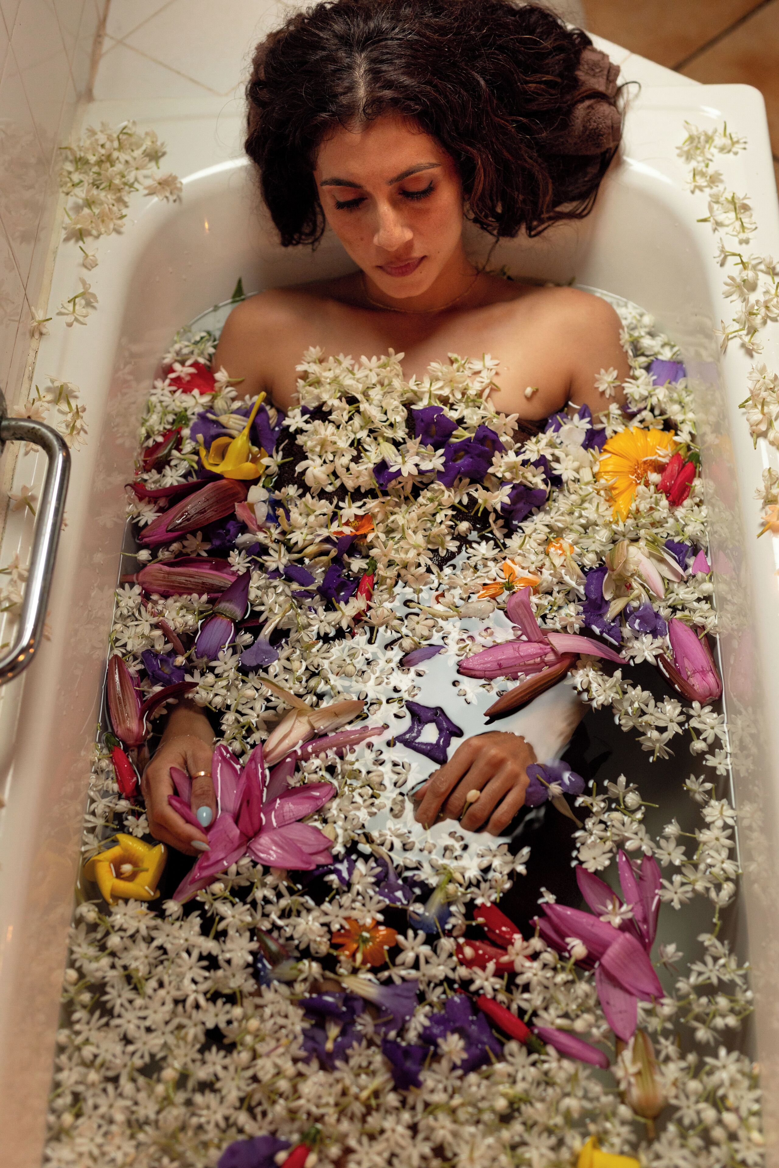 A bathtub filled with flowers.