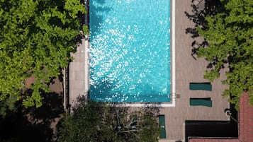 Outdoor pool, open 8:30 AM to 7:00 PM, pool loungers