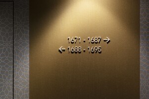 A wall with directional arrows and years indicating historical periods.
