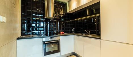 Apartment, 1 Bedroom (For 4) | Private kitchenette | Fridge, stovetop, dishwasher, coffee/tea maker