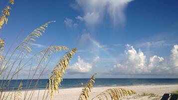 On the beach, sun-loungers, beach umbrellas, beach towels