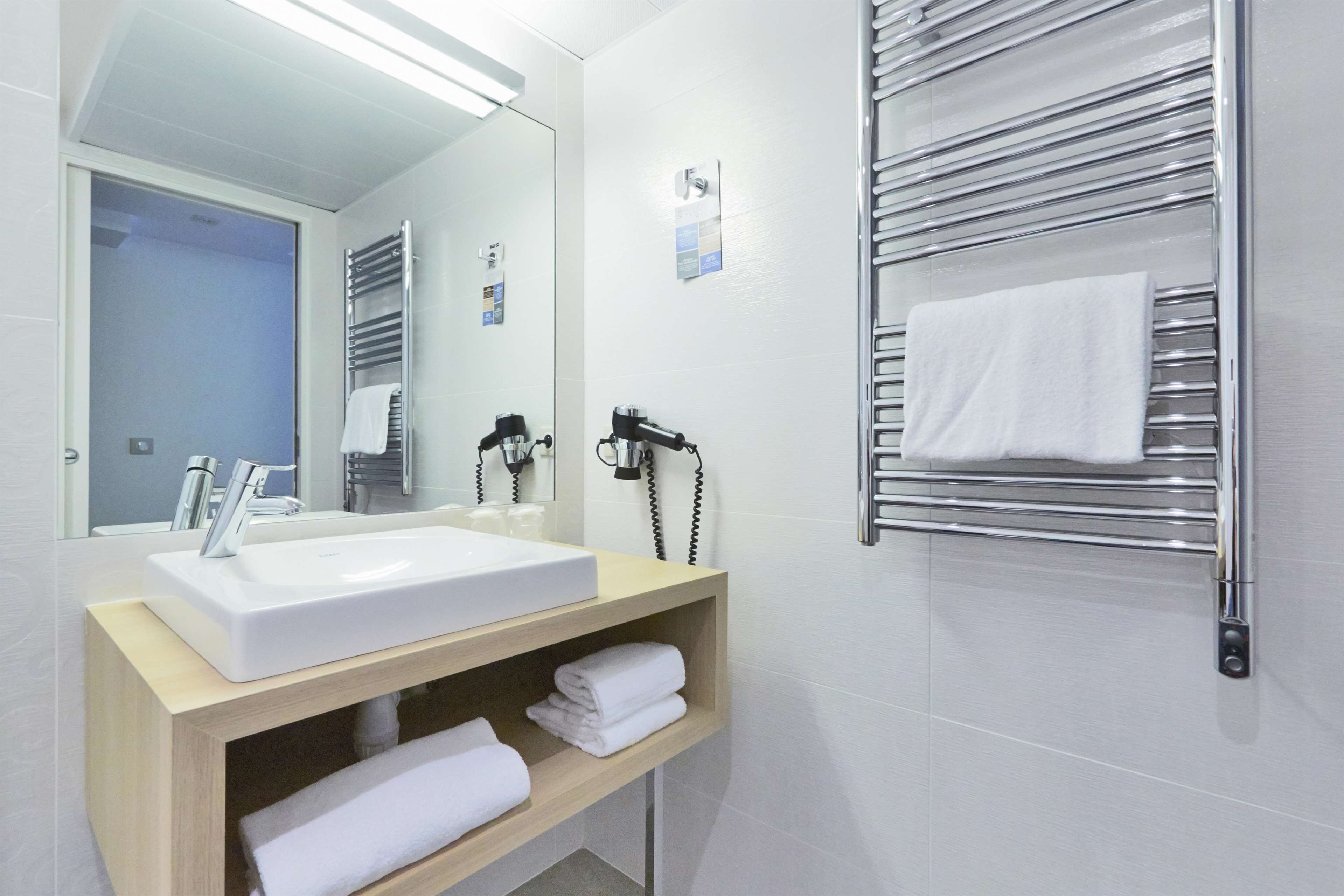 eco-friendly toiletries, hair dryer, towels