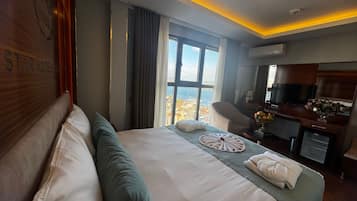 Superior Double or Twin Room, Sea View | Minibar, in-room safe, desk, laptop workspace