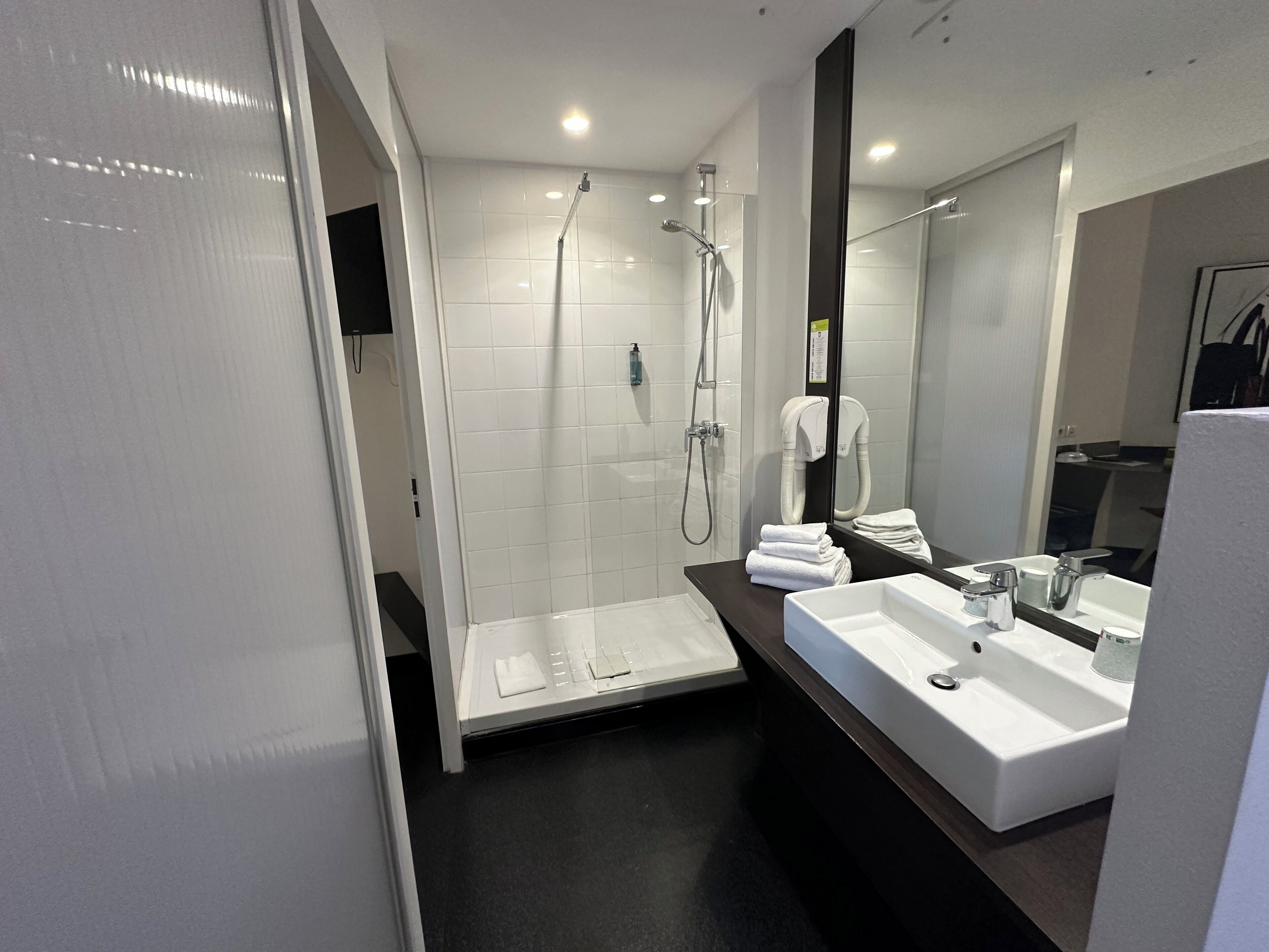 shower, free toiletries, hair dryer, towels