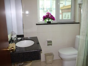 Standard Room, 1 King Bed(Chinese Citizen Only) | Bathroom | Shower, hair dryer, slippers, towels