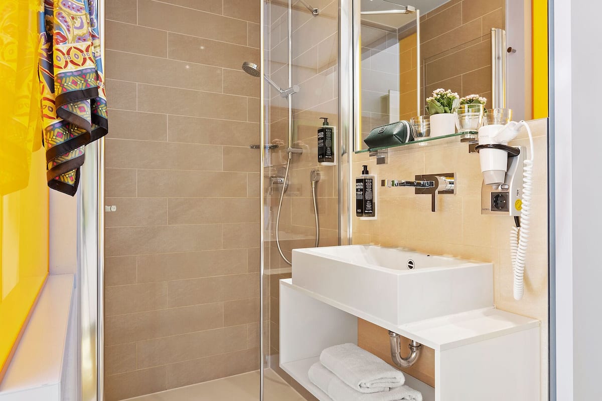 shower, eco-friendly toiletries, hair dryer, towels