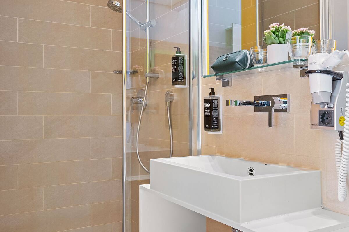 shower, eco-friendly toiletries, hair dryer, towels