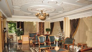 A luxurious lobby with ornate ceiling, plush seating, and a large chandelier. - Alfa Hotel (Istanbul)